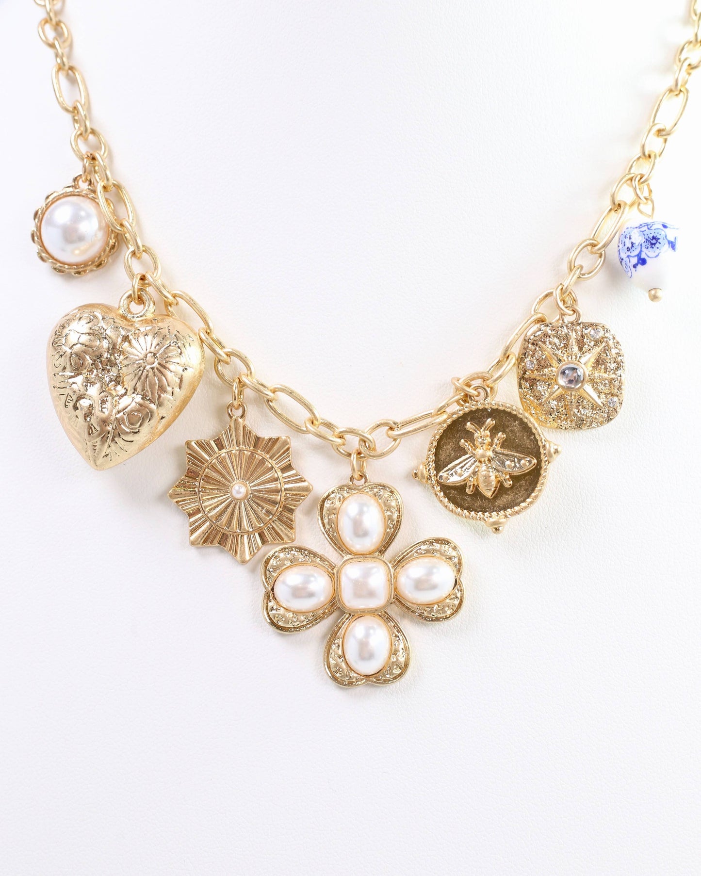 Verona Gold and Pearl Charm Necklace Worn Gold